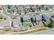 Aerial view featuring homes with green lawns and tree-lined streets creating a sense of community and curb appeal at 5149 S Tibet St, Aurora, CO 80015