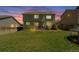 A spacious backyard with a lush green lawn and a small patio area, perfect for outdoor relaxation at 5149 S Tibet St, Aurora, CO 80015