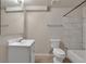 Updated bathroom boasts a modern vanity, stylish tiling, and a shower-over-tub combination at 5149 S Tibet St, Aurora, CO 80015
