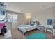 bedroom includes carpeting, a window, and a vanity with a mirror at 5149 S Tibet St, Aurora, CO 80015