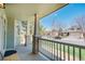Inviting front porch with stone columns providing a charming view of the well-maintained street and neighborhood at 5149 S Tibet St, Aurora, CO 80015