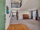 View of the living room featuring beautiful hardwood floors, stairs, an open view, and large windows at 5149 S Tibet St, Aurora, CO 80015