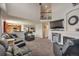 Open-concept living space with fireplace, upstairs overlook, and seamless flow to the kitchen at 5149 S Tibet St, Aurora, CO 80015