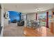 Well-designed living space seamlessly connects a spacious living room to a dining area and kitchen at 5149 S Tibet St, Aurora, CO 80015