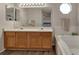 Large main bathroom features a soaking tub, double vanity, and a separate toilet room at 5149 S Tibet St, Aurora, CO 80015