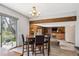 Cozy dining area open to the living room with a view of the backyard at 7942 S Vincennes Way, Centennial, CO 80112