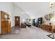 Spacious living room with vaulted ceilings, a cozy couch, and ample natural light at 7942 S Vincennes Way, Centennial, CO 80112