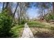 Peaceful path winding through a park-like setting with mature trees and a well-maintained landscape at 7942 S Vincennes Way, Centennial, CO 80112