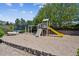 Community playground area with slide, climbing structure and bench seating at 7942 S Vincennes Way, Centennial, CO 80112