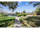 Community park featuring tennis courts, open green space, and a playground with slide for Gathering fun at 7942 S Vincennes Way, Centennial, CO 80112