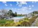Community pool featuring a covered lounge area, meticulously maintained landscaping, and a pristine swimming pool at 7942 S Vincennes Way, Centennial, CO 80112
