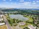 Expansive aerial view showcasing the community, lake, and surrounding landscape at 10950 W Florida Ave # 314, Lakewood, CO 80232