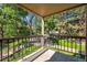 Balcony view overlooking lush green trees and landscaping with steel railing and concrete flooring at 10950 W Florida Ave # 314, Lakewood, CO 80232