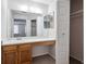 Bathroom with built-in vanity with additional storage and large mirror at 10950 W Florida Ave # 314, Lakewood, CO 80232