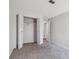 Bedroom featuring a large closet, neutral carpet, and view of connecting rooms at 10950 W Florida Ave # 314, Lakewood, CO 80232