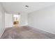Bedroom with carpeting and access to bathroom with vanity at 10950 W Florida Ave # 314, Lakewood, CO 80232