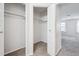 Large walk-in closet featuring installed shelving and bar for ample storage at 10950 W Florida Ave # 314, Lakewood, CO 80232