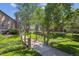 Well-maintained community grounds with foot bridge, mature trees, and manicured lawns at 10950 W Florida Ave # 314, Lakewood, CO 80232