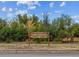 Main Reservoir sign showing the location at 10721 W. Florida Ave surrounded by lush greenery at 10950 W Florida Ave # 314, Lakewood, CO 80232