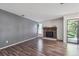 Spacious living room with hardwood floors, stone fireplace, and natural light at 10950 W Florida Ave # 314, Lakewood, CO 80232