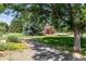 Picturesque playground with colorful equipment nestled among mature trees and lush green grass at 10950 W Florida Ave # 314, Lakewood, CO 80232