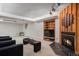Finished basement area with carpet, fireplace, accent lighting, and a wet bar with shelving at 3312 S Ouray Way, Aurora, CO 80013