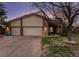 Charming home featuring a spacious three-car garage and well-maintained landscaping at 3312 S Ouray Way, Aurora, CO 80013