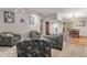 Bright living room and dining room features hardwood floors, neutral paint, and comfortable armchairs at 3312 S Ouray Way, Aurora, CO 80013