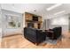 Cozy living room featuring a fireplace, hardwood floors, and a bay window at 3312 S Ouray Way, Aurora, CO 80013