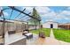 Inviting backyard patio with pergola, seating, and well-maintained lawn, perfect for outdoor relaxation at 3155 N Steele St, Denver, CO 80205