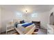Basement bedroom with stylish decor, a comfortable bed, and great natural light at 3155 N Steele St, Denver, CO 80205