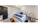 Cozy bedroom featuring a comfortable bed, modern lighting, and stylish décor at 3155 N Steele St, Denver, CO 80205