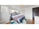 Comfortable bedroom with bright white walls, stylish lighting, and cozy decor at 3155 N Steele St, Denver, CO 80205