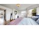 Light bedroom featuring stylish decor, a dresser, and warm hardwood floors at 3155 N Steele St, Denver, CO 80205