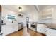 Bright, updated kitchen featuring modern appliances, white cabinetry, and stylish countertops at 3155 N Steele St, Denver, CO 80205