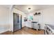 Modern kitchen featuring stainless steel appliances, sleek white cabinetry, and black countertops at 3155 N Steele St, Denver, CO 80205