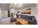 Inviting living room showcasing a plush couch, stylish décor, and ample space for relaxation at 3155 N Steele St, Denver, CO 80205