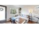 Cozy living room with a large window, stylish furniture, and modern decor at 3155 N Steele St, Denver, CO 80205
