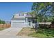 Two-story house with gray siding, green door, and a landscaped lawn at 20493 E Hampden Pl, Aurora, CO 80013
