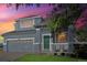 Two-story house with gray siding, green door, and a landscaped lawn at 20493 E Hampden Pl, Aurora, CO 80013