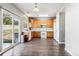 Eat-in kitchen with wood cabinets and sliding glass door to backyard at 20493 E Hampden Pl, Aurora, CO 80013