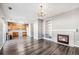 Open living room and kitchen area with hardwood floors and a fireplace at 20493 E Hampden Pl, Aurora, CO 80013