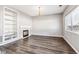 Living room with fireplace, built-in shelves, and hardwood floors at 20493 E Hampden Pl, Aurora, CO 80013