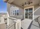 Covered back porch with ceiling fan and sliding glass door entrance at 10371 Harrisburg St, Parker, CO 80134