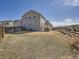 Spacious backyard with wooden fence and lawn at 10371 Harrisburg St, Parker, CO 80134