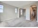 Open living room with neutral carpet and arched doorways at 10371 Harrisburg St, Parker, CO 80134