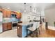 Open-concept kitchen featuring stainless steel appliances, a granite island, and bar stool seating at 7476 E Arkansas Ave # 35-01, Denver, CO 80231
