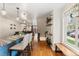 Bright kitchen extends to a dining area with a bench, creating a seamless flow of living space at 7476 E Arkansas Ave # 35-01, Denver, CO 80231