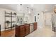 Contemporary kitchen featuring an island with a sink, stainless steel appliances, and ample counter space at 7476 E Arkansas Ave # 35-01, Denver, CO 80231