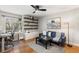 Den featuring built-in shelving, desk, stylish decor, and natural light at 7476 E Arkansas Ave # 35-01, Denver, CO 80231